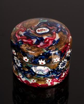 Appraisal: A circular snuff box the metal overlaid with glass millefiori