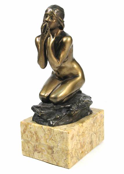 Appraisal: A patinated bronze figure of a kneeling nude female cast