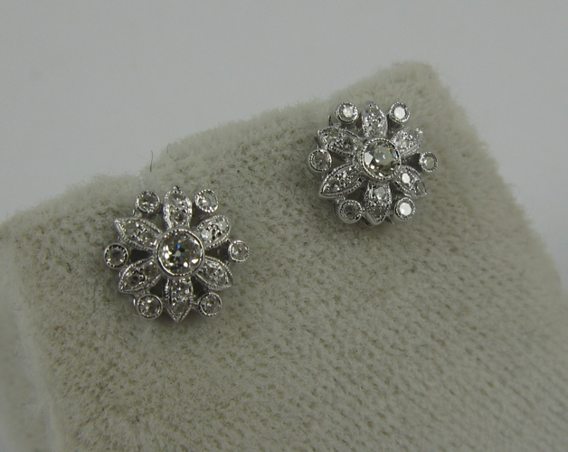 Appraisal: PAIR OF DIAMOND AND K WHITE GOLD EARRINGS each covered