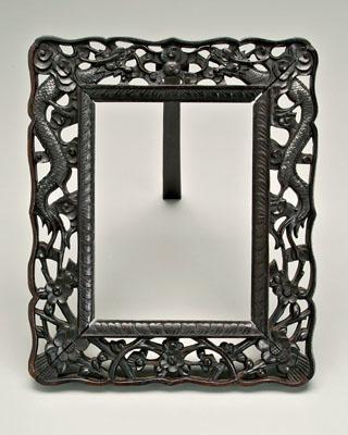 Appraisal: Chinese hardwood picture frame dense dark wood openwork borders of