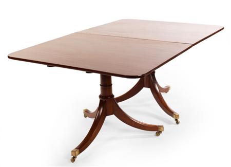 Appraisal: A mahogany twin pedestal dining table the rounded rectangular top