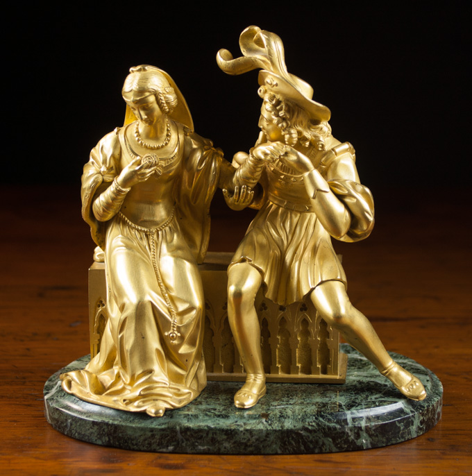 Appraisal: GILT BRONZE FIGURAL SCULPTURE OF ROMEO AND JULIETTE mounted to