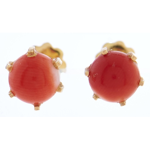 Appraisal: A pair of coral bead stud earrings in gold g