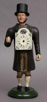 Appraisal: CONTINENTAL CARVED AND PAINTED WOOD FIGURAL CLOCK Modeled as a