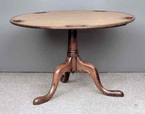 Appraisal: An early George III mahogany circular tripod games table the