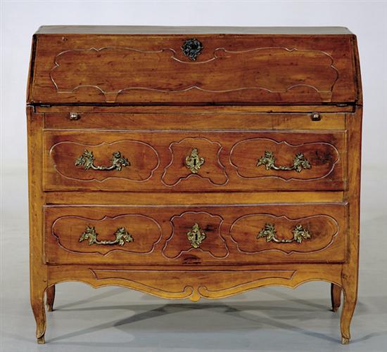 Appraisal: French Provincial carved walnut serpentine desk circa rectangular case with