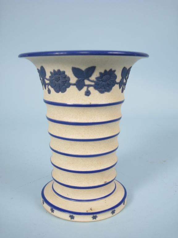 Appraisal: A Hackwood Co ribbed stoneware Vase with blue rims and