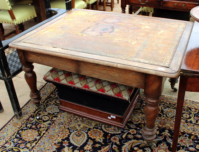 Appraisal: A MAHOGANY LIBRARY TABLE with brown leather inset top and