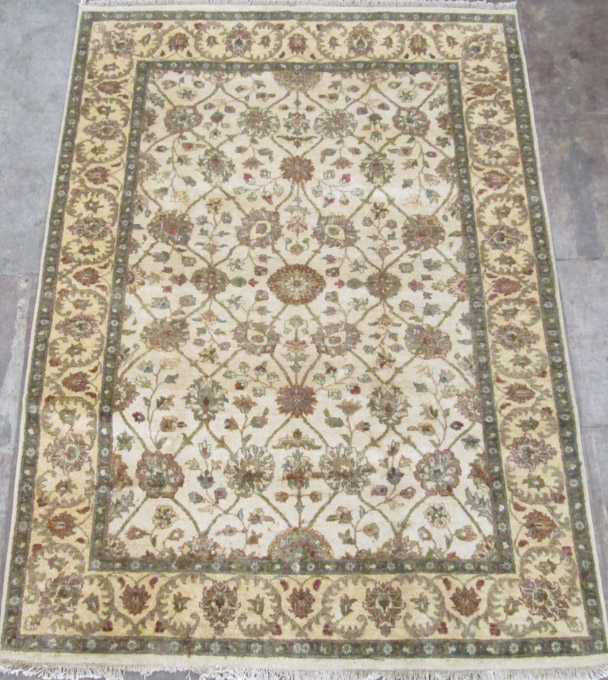 Appraisal: HAND KNOTTED ORIENTAL CARPET Indo-Persian overall floral design on cream