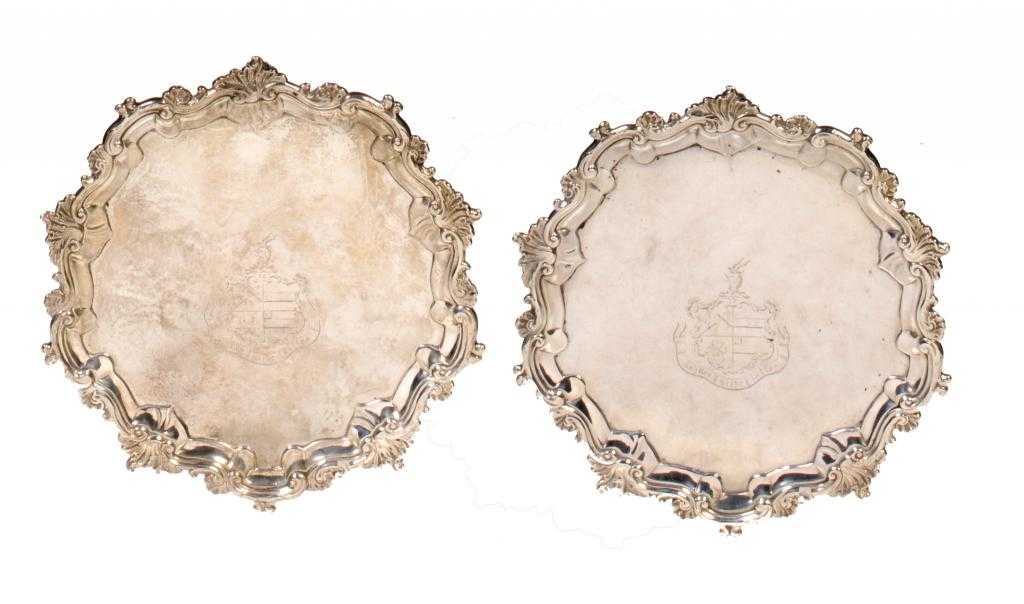 Appraisal: A PAIR OF GEORGE III WAITERS the field engraved with