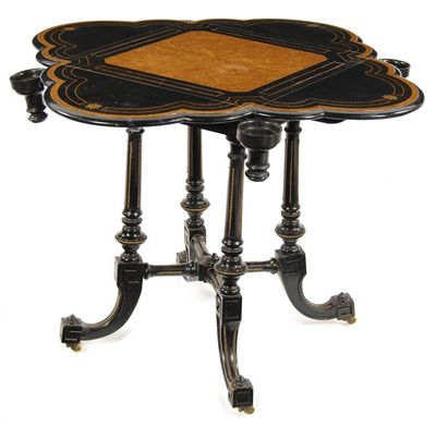 Appraisal: A Victorian ebonised and amboyna card table with four trefoil