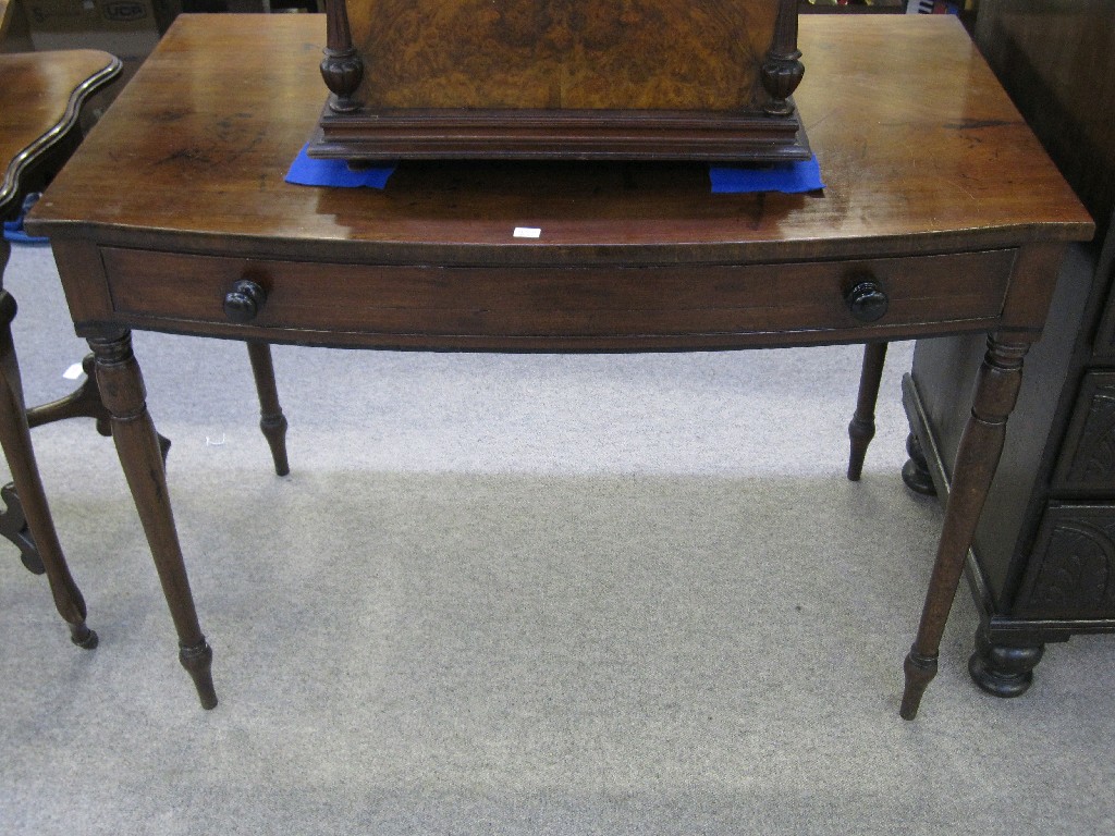 Appraisal: Mahogany bow front side table with central drawers and upon