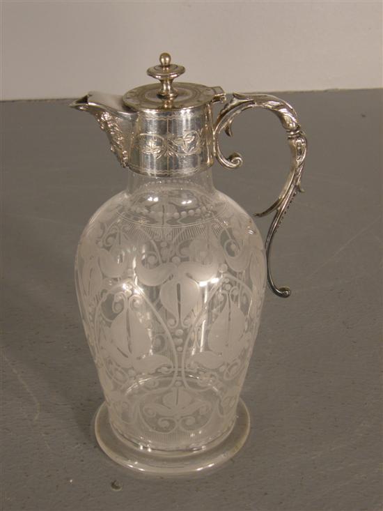 Appraisal: Edwardian glass claret jug with silver plated mounts and etched