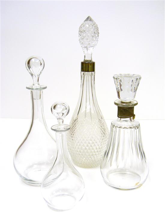 Appraisal: Four colorless glass decanters including three Baccarat one with chipped