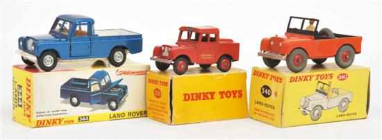 Appraisal: THREE DINKY LAND ROVERS including Dinky orange dark green seats