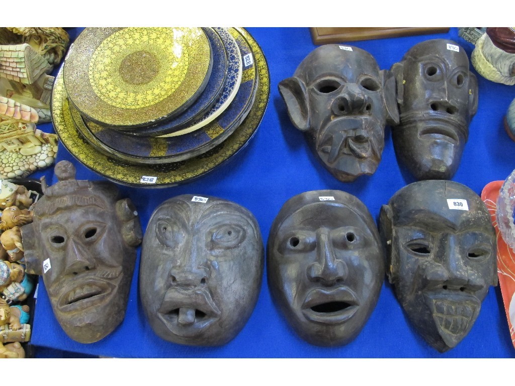 Appraisal: Six carved wooden grotesque masks