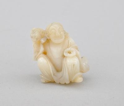 Appraisal: Hardstone Okimono of Seated Man with Saru-mawashi Carved white hardstone