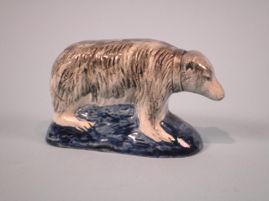 Appraisal: A mid thC Staffordshire pottery bear with a black and