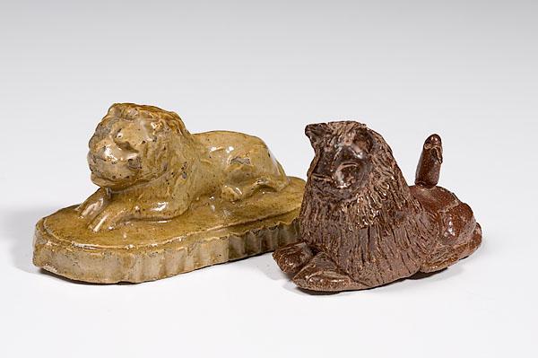 Appraisal: TWO OHIO POTTERY LION PAPERWEIGHTS early th century one of