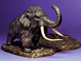 Appraisal: BRONZE SCULPTURE OF A WOOLLY MAMMOTH By Victor M Pracas