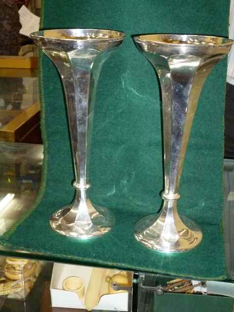 Appraisal: A PAIR OF SILVER TRUMPET VASES with weighted bases high