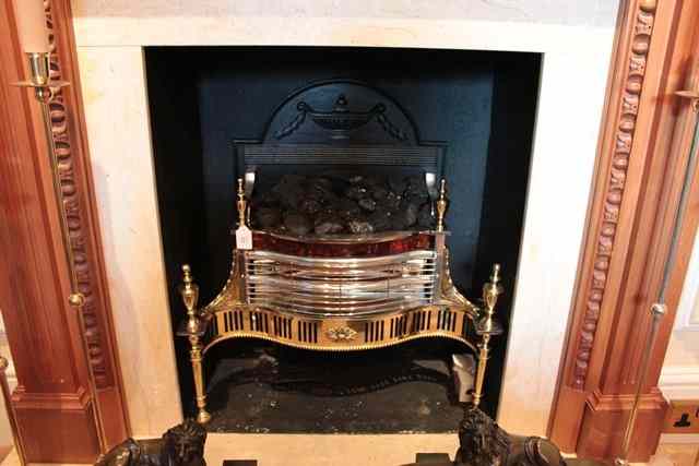 Appraisal: A GEORGIAN STYLE BRASS AND POLISHED STEEL FIRE GRATE with