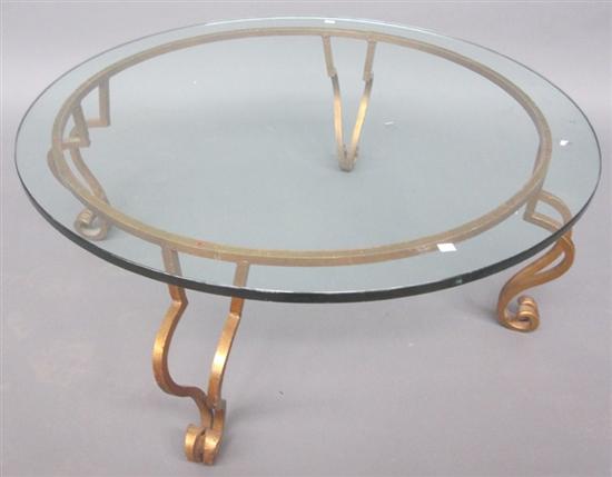 Appraisal: COCKTAIL TABLE th C The circular glass top resting on