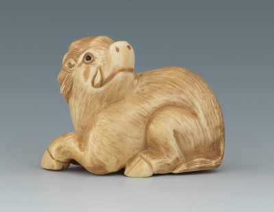 Appraisal: A Carved Ivory Nestuke of a Boar Depicting a recumbent