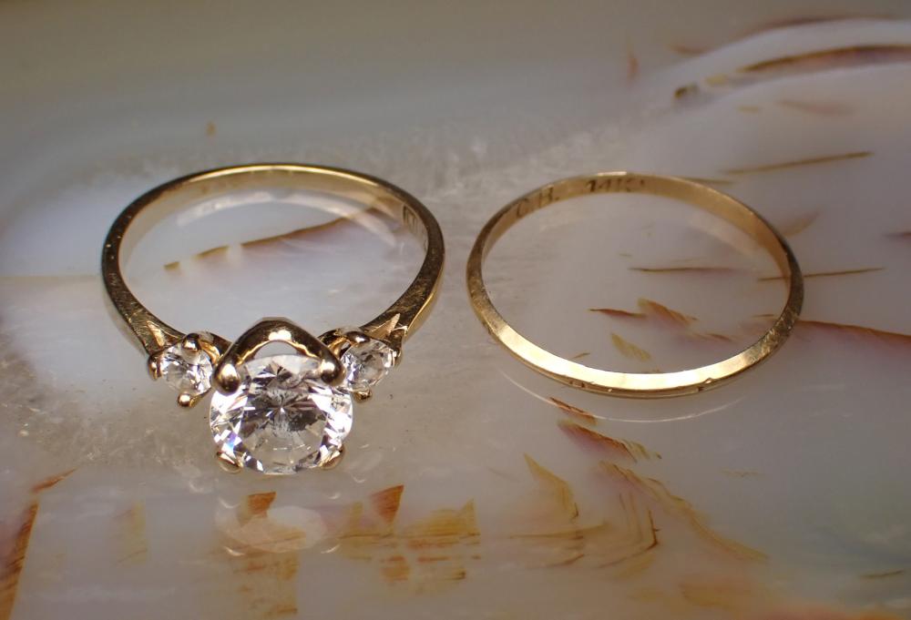 Appraisal: TWO FOURTEEN KARAT YELLOW GOLD RINGS including a k gold