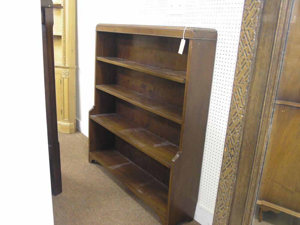 Appraisal: A mahogany open bookcase with two adjustable shelves ft in