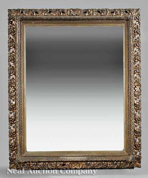 Appraisal: A Large Beaux Arts Carved and Gilded Mirror late th