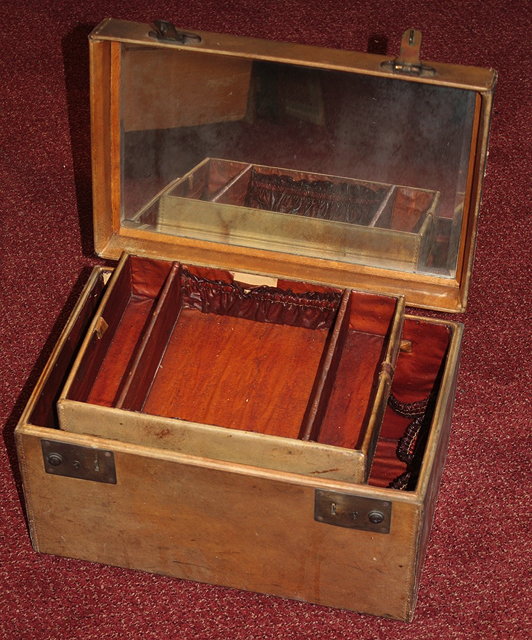 Appraisal: A CONTINENTAL NATURAL RAW HIDE DRESSING CASE with fitted interior