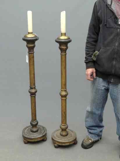 Appraisal: Pair wooden candle floor standards '' Ht each