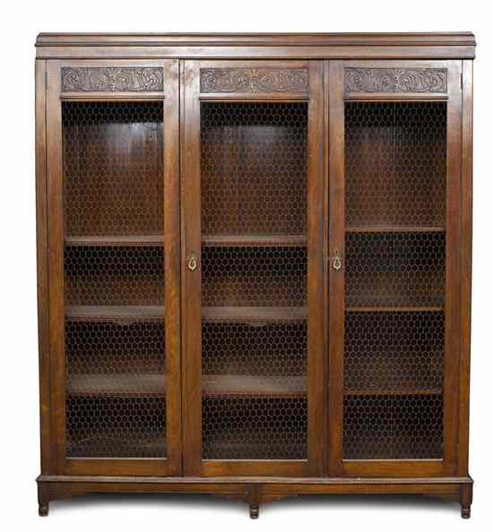 Appraisal: A French Provincial Oak Cabinet having a molded cornice over