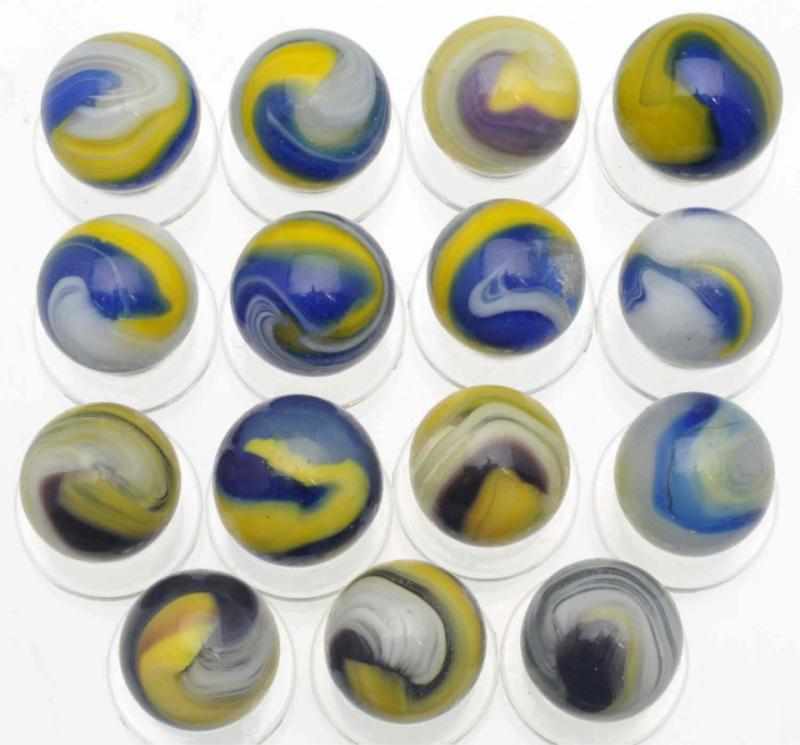 Appraisal: Lot of Akro Agate Marbles Includes six yellow blue and