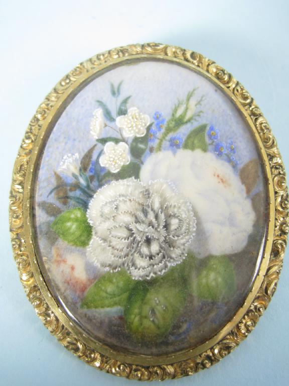 Appraisal: A gilt-metal oval Brooch containing a miniature painting of flowers