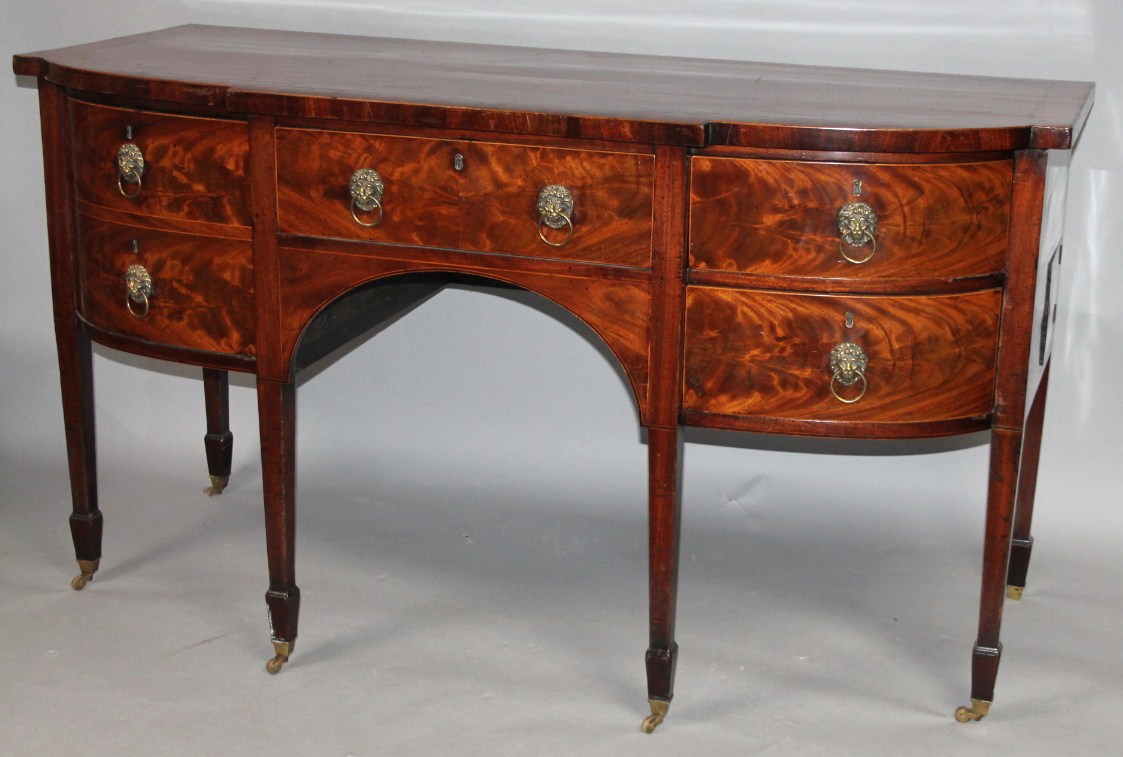 Appraisal: A George III mahogany and flame mahogany sideboard of D-end