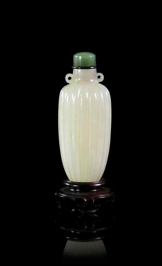 Appraisal: A Carved Jade Pendant Form Snuff Bottle of near white