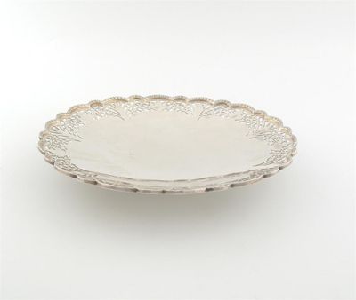 Appraisal: A modern pierced circular cake plate with an applied polyfoil