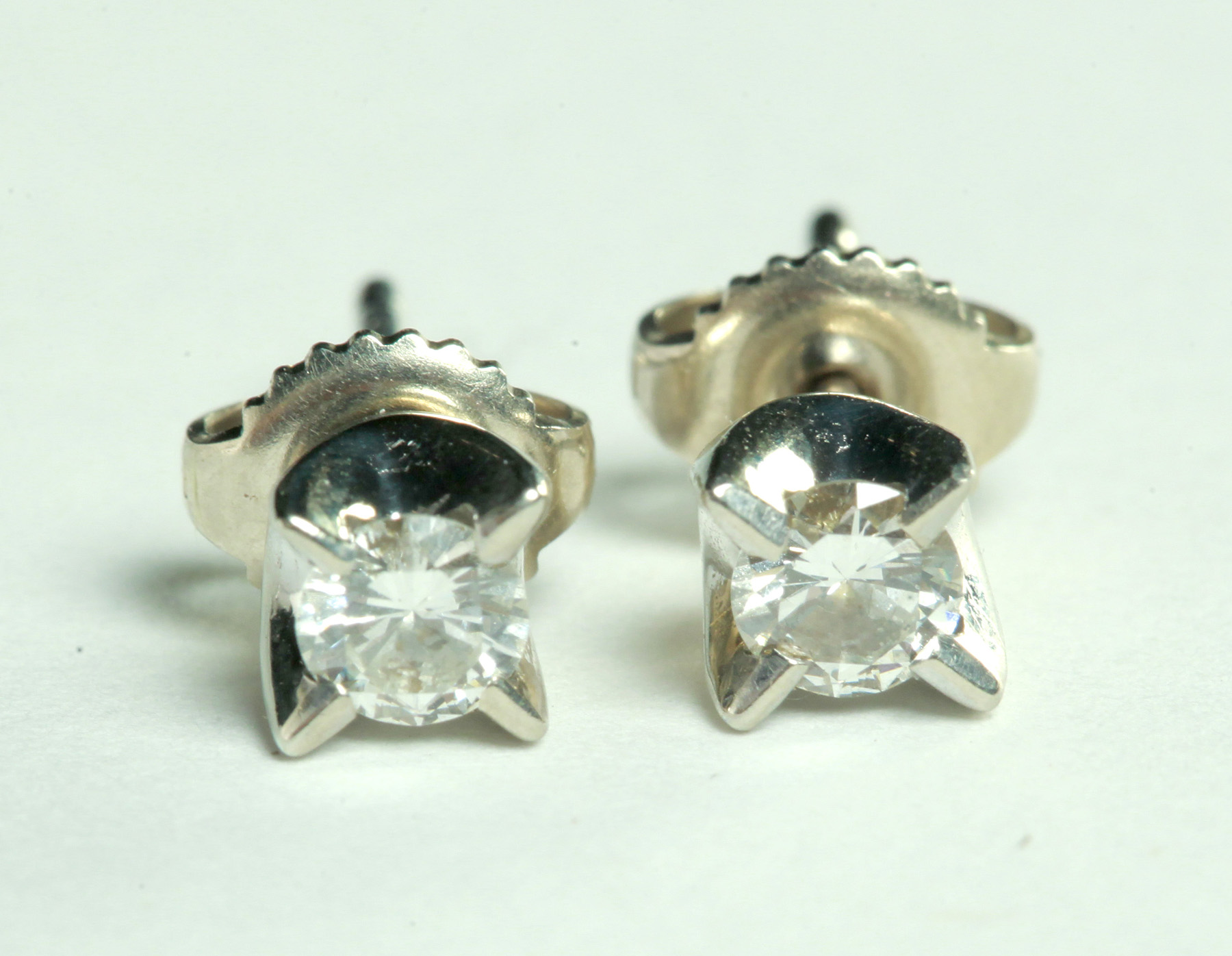 Appraisal: PAIR OF DIAMOND STUD EARRINGS American th century k white