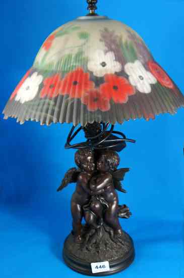 Appraisal: A lamp base decorated with cupids standing cm high with