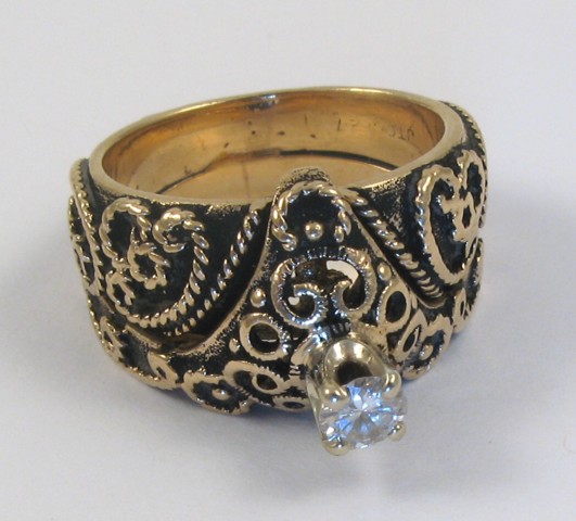 Appraisal: DIAMOND AND FOURTEEN KARAT GOLD RING set with a single