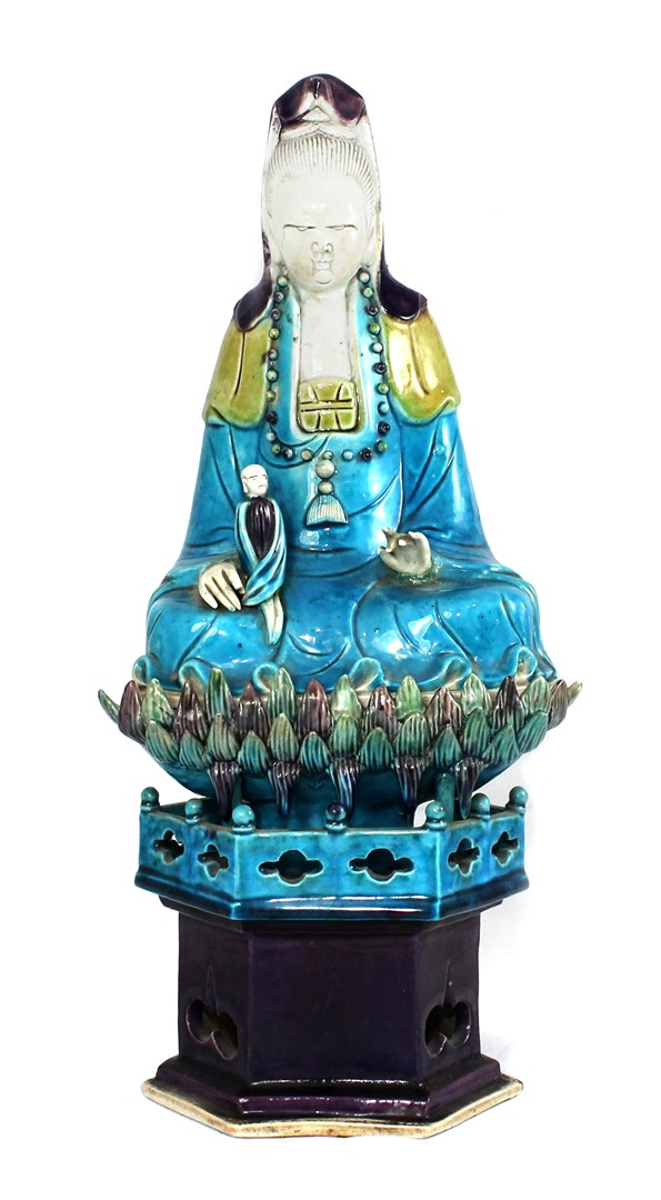 Appraisal: A Chinese biscuit group of Guanyin probably Kangxi modelled seated