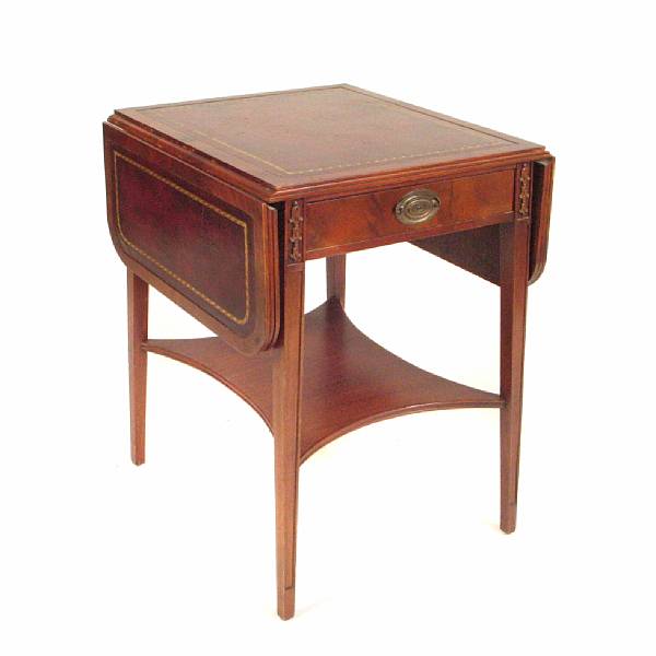 Appraisal: A George III style drop leaf table with inset leather