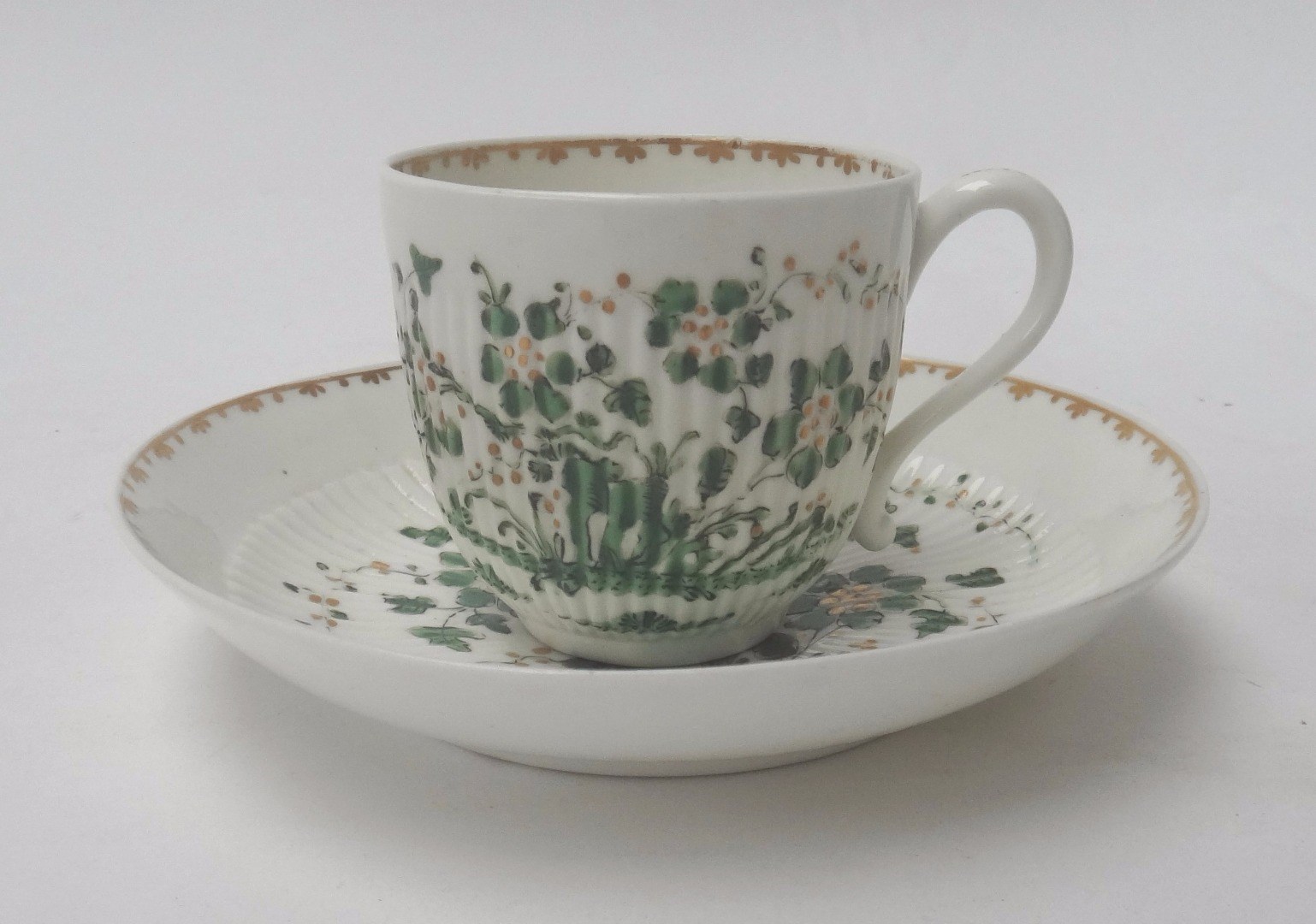 Appraisal: An unusual Derby ribbed coffee cup and saucer circa painted