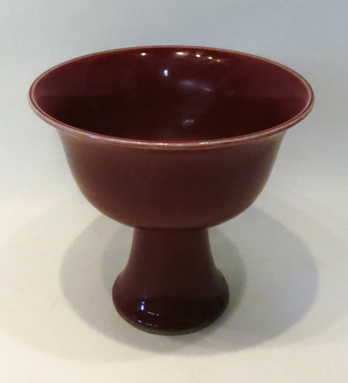 Appraisal: CHINESE RED SANG DE BEOUF GLAZED FOOTED BOWL raised on