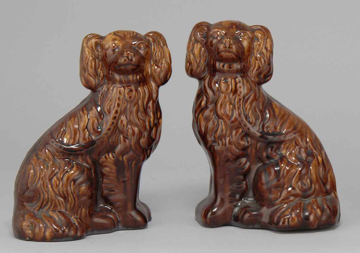 Appraisal: PAIR OF ROCKINGHAM POTTERY SPANIELS th CenturyHeight