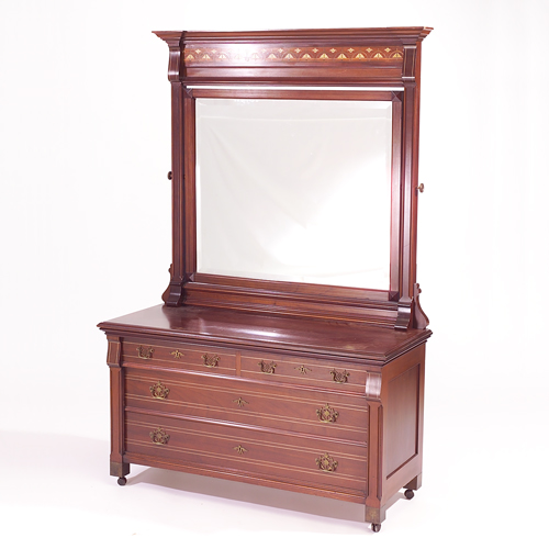 Appraisal: Two-over-two Aesthetic mahogany chest of drawers th century en suite