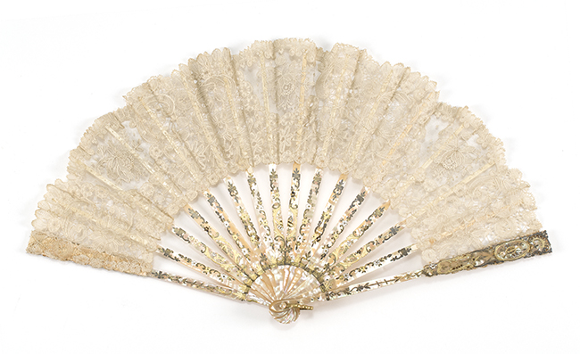 Appraisal: LACE AND MOTHER-OF-PEARL FOLDING FAN th CenturyFine white lace leaf