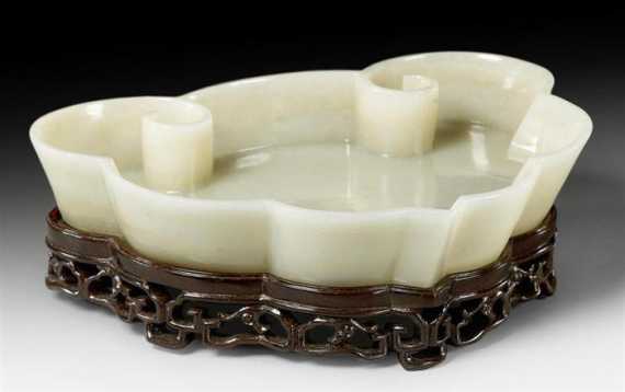 Appraisal: TRANSLUCENT PALE GREEN JADE RUYI SHAPED BOWL China th century